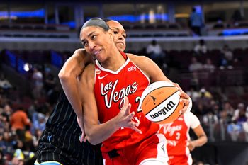 Jun 28, 2026; Chicago, Illinois, USA;  Las Vegas Aces center A'ja Wilson (22) drives to the basket against Chicago Sky forward-center  Azura Stevens (30) during the second half at United Center. Mandatory Credit: Matt Marton-Imagn Images