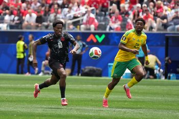 Jun 28, 2026; Inglewood, California, USA; Canada forward Jonathan David (10) and South Africa defender Olwethu Makhanya (24) battle for the ball during a Round of 32 match in the 2026 FIFA World Cup at Los Angeles Stadium. Mandatory Credit: Kirby Lee-Imagn Images