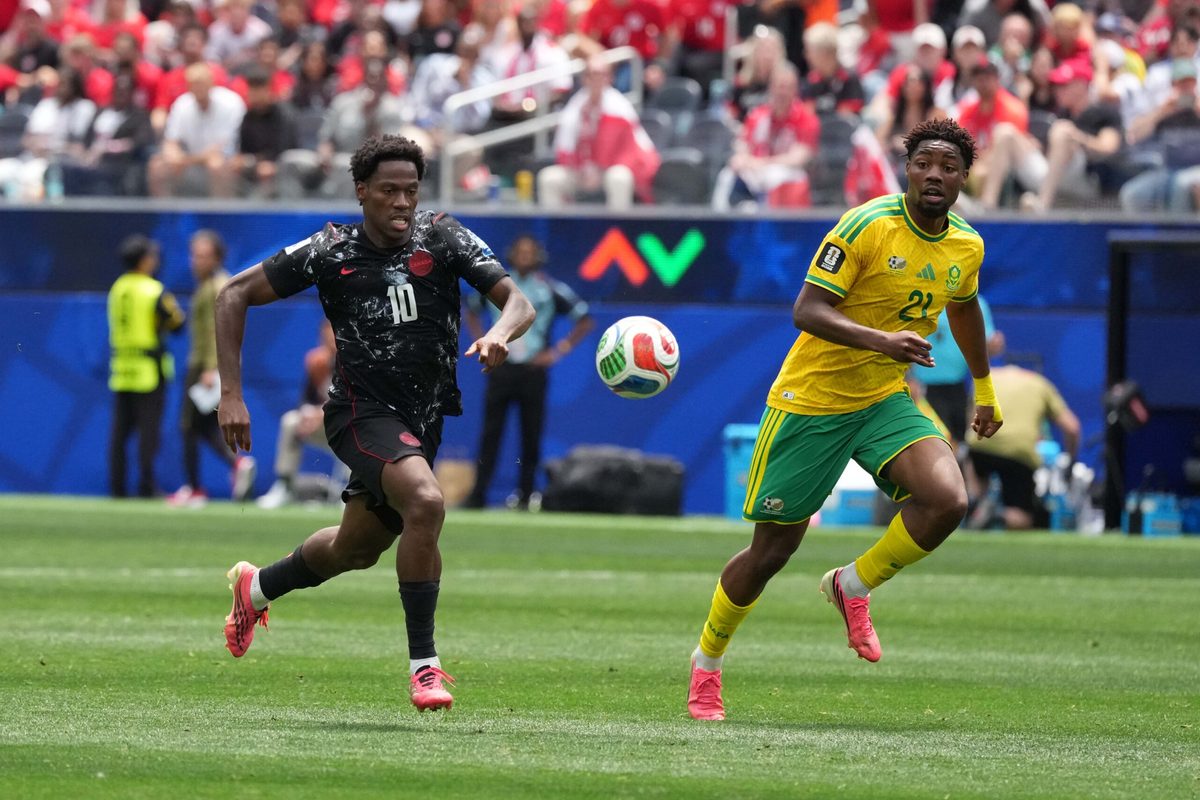 Jun 28, 2026; Inglewood, California, USA; Canada forward Jonathan David (10) and South Africa defender Olwethu Makhanya (24) battle for the ball during a Round of 32 match in the 2026 FIFA World Cup at Los Angeles Stadium. Mandatory Credit: Kirby Lee-Imagn Images