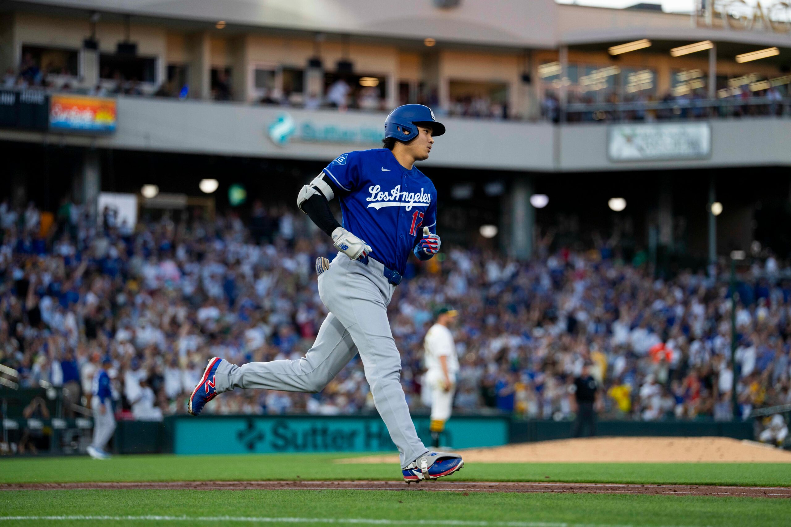 Jun 29, 2026; West Sacramento, California, USA; Los Angeles Dodgers designated hitter Shohei Ohtani (17) runs toward first after hitting a three-run home run against the Athletics in the sixth inning at Sutter Health Park. Mandatory Credit: Cary Edmondson-Imagn Images