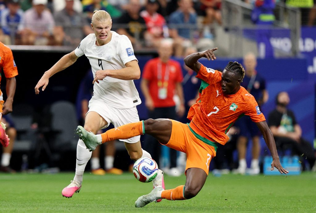 June 30, 2026; Arlington, Texas, U.S.; Norway's Erling Haaland in action with Ivory Coast's Odilon Kossounou. Mandatory Credit: Tim Heitman-Imagn Images