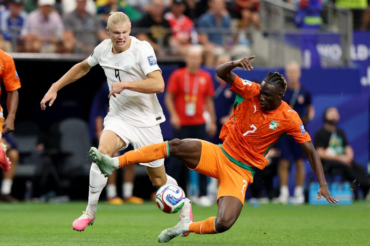 June 30, 2026; Arlington, Texas, U.S.; Norway's Erling Haaland in action with Ivory Coast's Odilon Kossounou. Mandatory Credit: Tim Heitman-Imagn Images