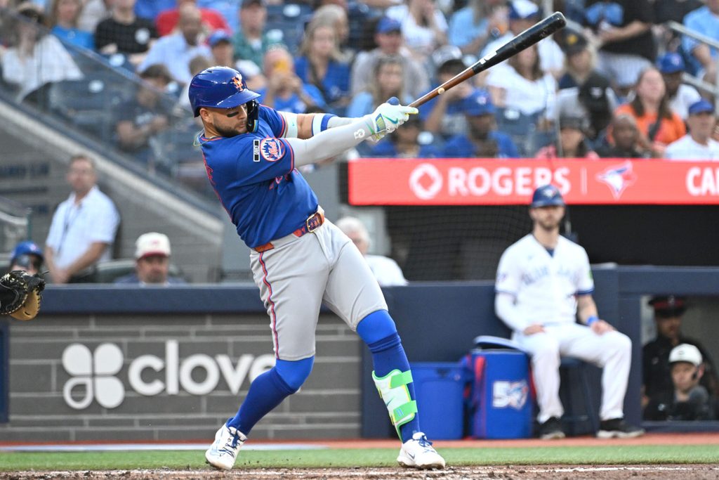 Jun 30, 2026; Toronto, Ontario, CAN; New York Mets third baseman Bo Bichette (19) hits a single against the Toronto Blue Jays in the third inning at Rogers Centre. Mandatory Credit: Dan Hamilton-Imagn Images