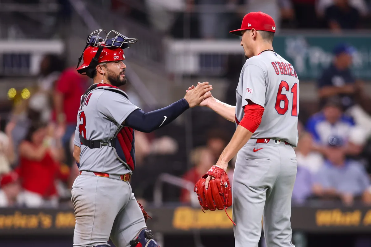 Jun 30, 2026; Atlanta, Georgia, USA; St. Louis Cardinals catcher Ivan Herrera (48) and pitcher Riley O'Brien (61) celebrate after a victory over the Atlanta Braves at Truist Park. Mandatory Credit: Brett Davis-Imagn Images