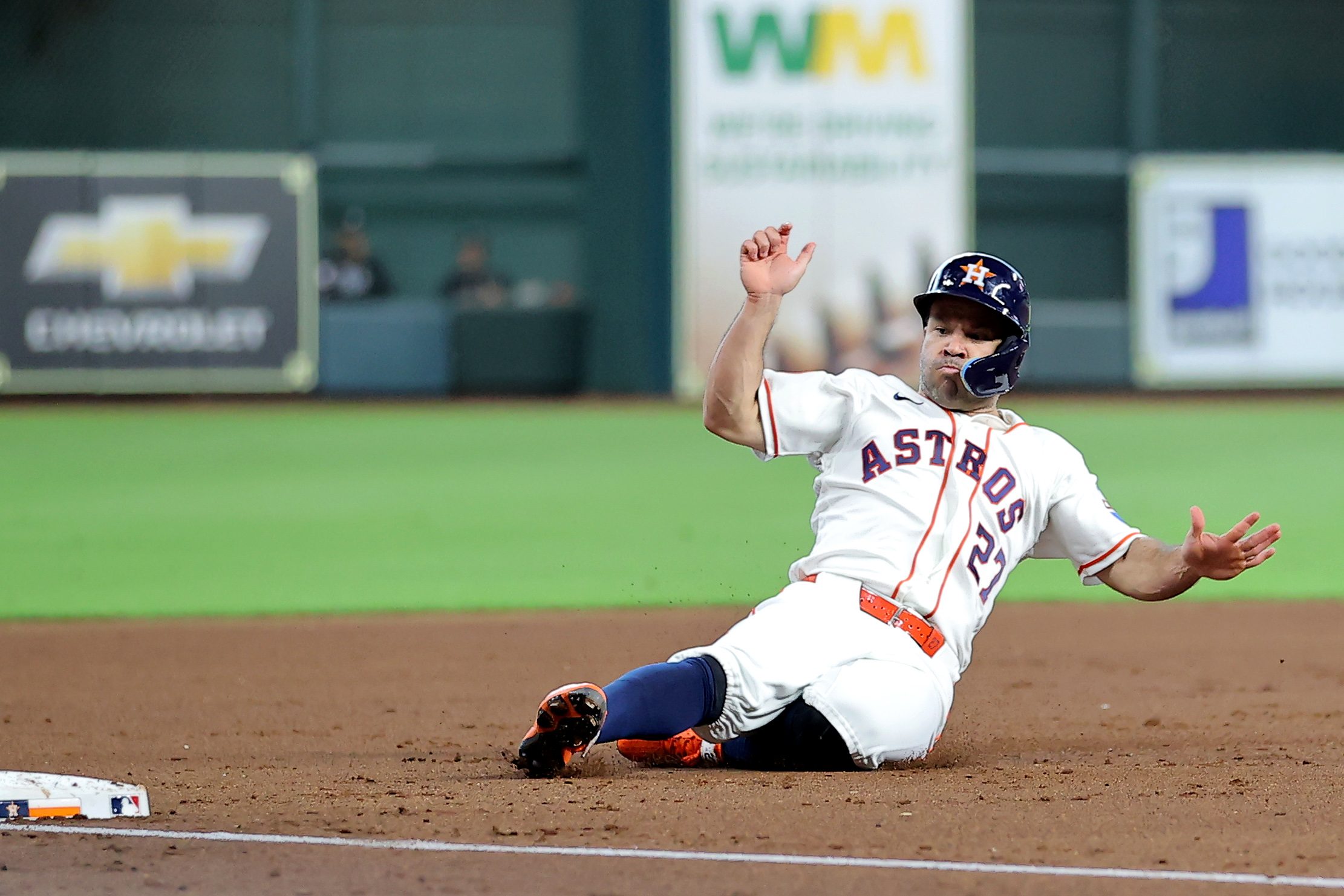 Jul 1, 2026; Houston, Texas, USA; Houston Astros second baseman Jose Altuve (27) slides into third base after a hit by designated hitter Yordan Alvarez (44, not shown) against the Minnesota Twins during the first inning at Daikin Park. Mandatory Credit: Erik Williams-Imagn Images
