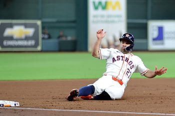 Jul 1, 2026; Houston, Texas, USA; Houston Astros second baseman Jose Altuve (27) slides into third base after a hit by designated hitter Yordan Alvarez (44, not shown) against the Minnesota Twins during the first inning at Daikin Park. Mandatory Credit: Erik Williams-Imagn Images