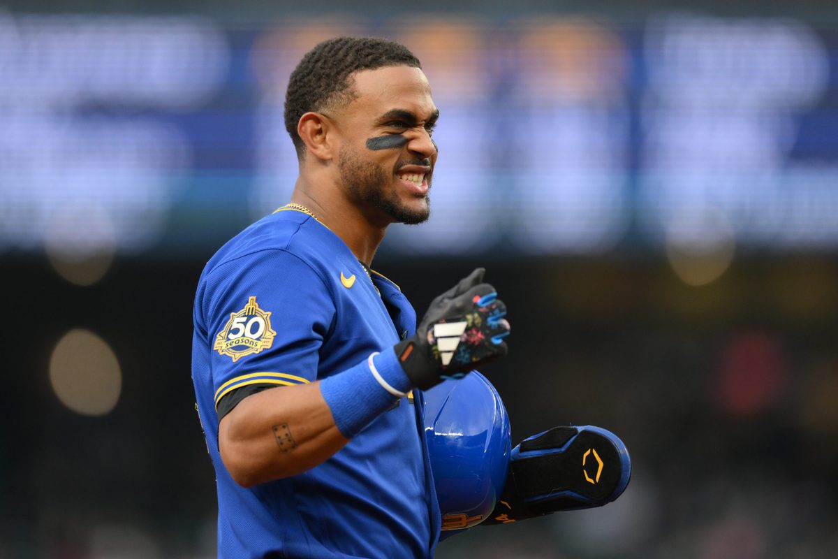 Jul 2, 2026; Seattle, Washington, USA; Seattle Mariners center fielder Julio Rodriguez (44) reacts to getting hit in the back of the helmet by a thrown ball during the first inning against the Los Angeles Angels at T-Mobile Park. Mandatory Credit: Steven Bisig-Imagn Images