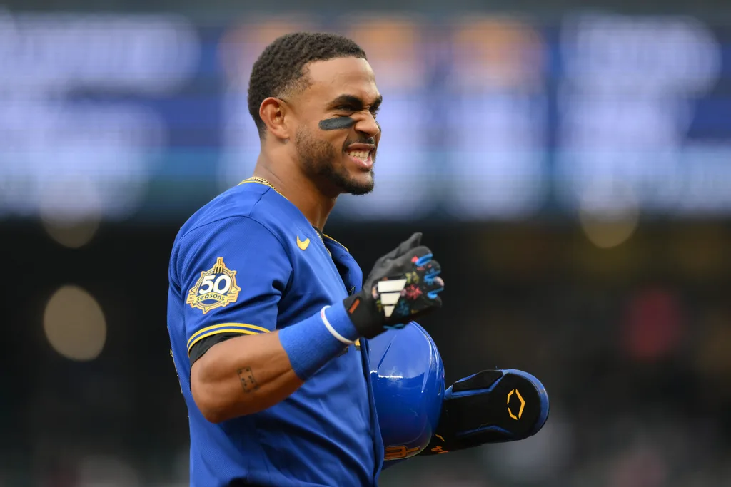 Jul 2, 2026; Seattle, Washington, USA; Seattle Mariners center fielder Julio Rodriguez (44) reacts to getting hit in the back of the helmet by a thrown ball during the first inning against the Los Angeles Angels at T-Mobile Park. Mandatory Credit: Steven Bisig-Imagn Images