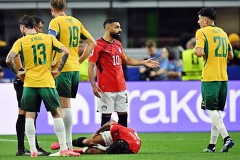 July 3, 2026; Arlington, Texas, U.S.; Egypt's Mohamed Salah and Australia's Cristian Volpato react as Egypt's Mohamed Hany is down after sustaining an injury.  Mandatory Credit: Jerome Miron-Imagn Images