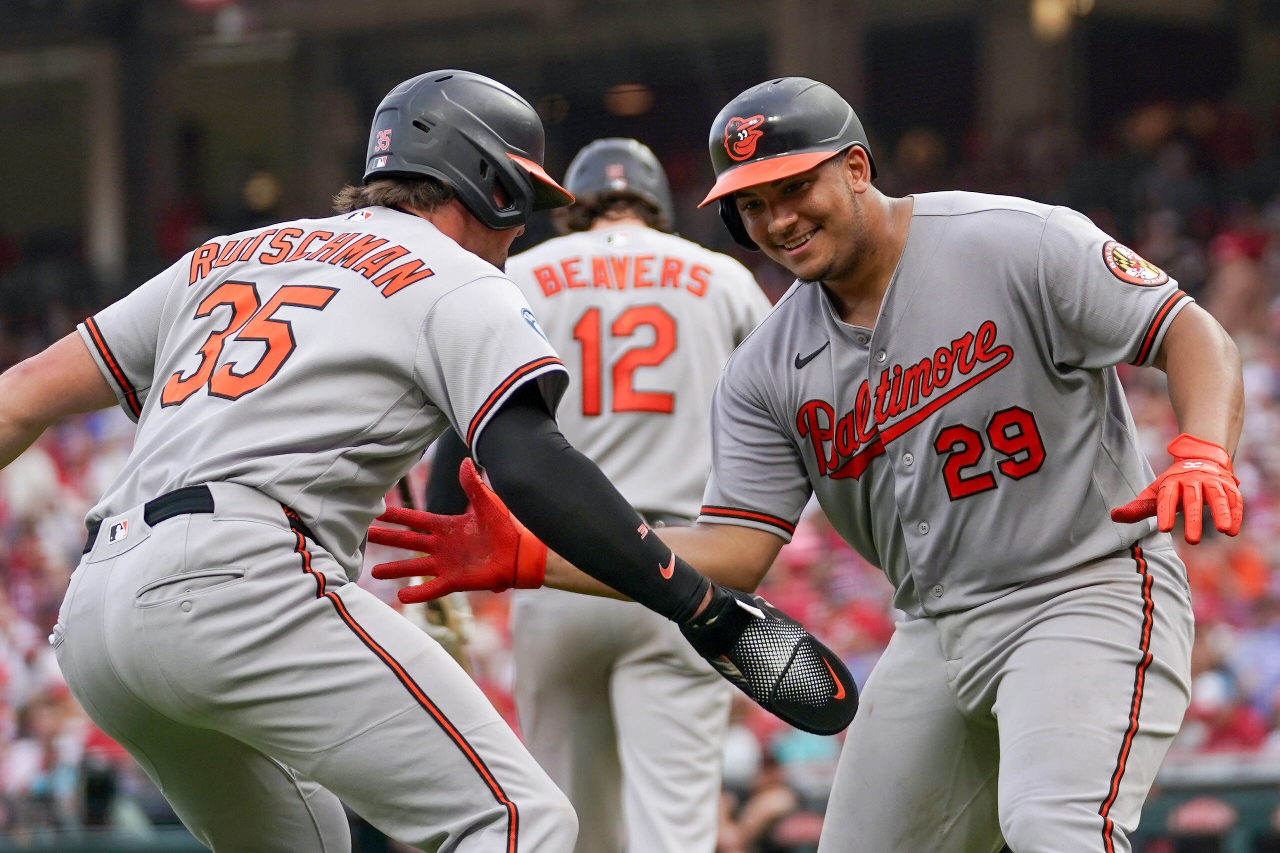 Baltimore Orioles catcher Samuel Bassallo (29) and designated hitter Adley Rutschman (35) celebrate after Bassallo scores a homer in the third inning of a MLB game between the Cincinnati Reds and Baltimore Orioles, Friday, July 3, 2026, at Great American Ball Park in downtown Cincinnati.