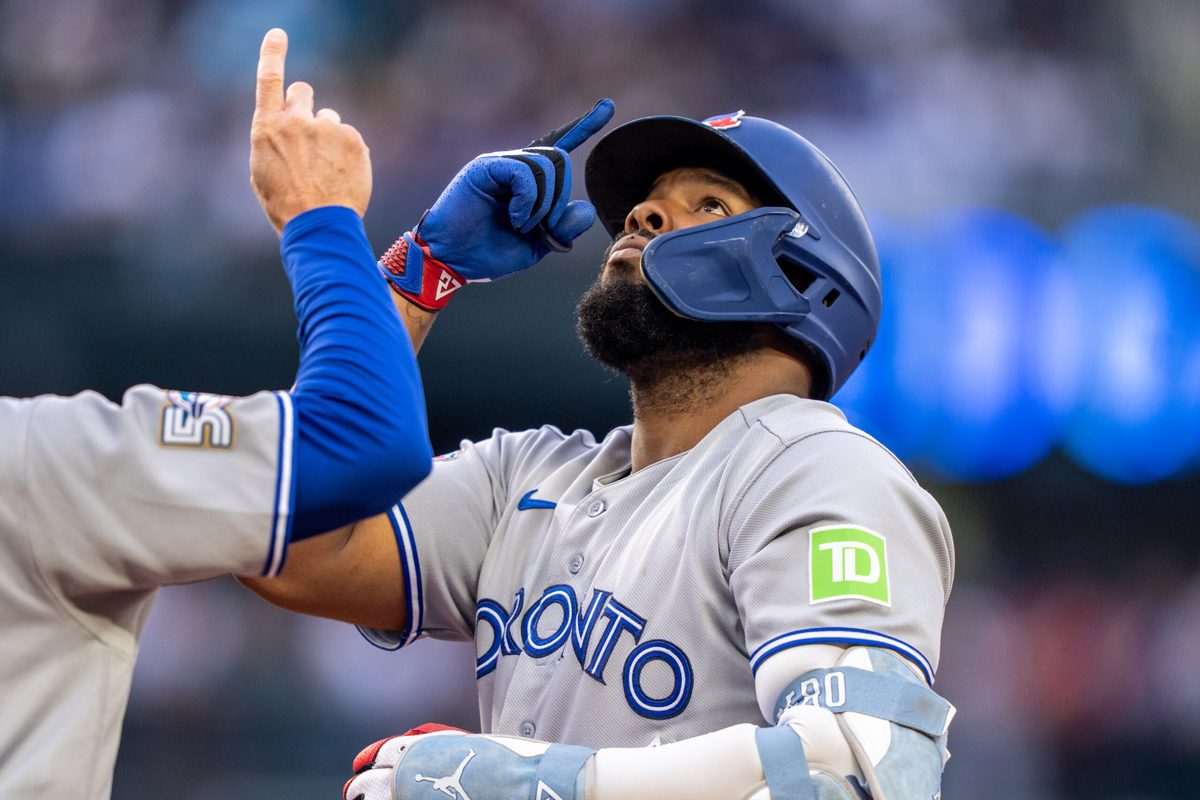 Jul 3, 2026; Seattle, Washington, USA;  Toronto Blue Jays first baseman Vladimir Guerrero Jr. (27) celebrates at first base after hitting a RBI-single during the third inning against the Seattle Mariners at T-Mobile Park. Mandatory Credit: Stephen Brashear-Imagn Images