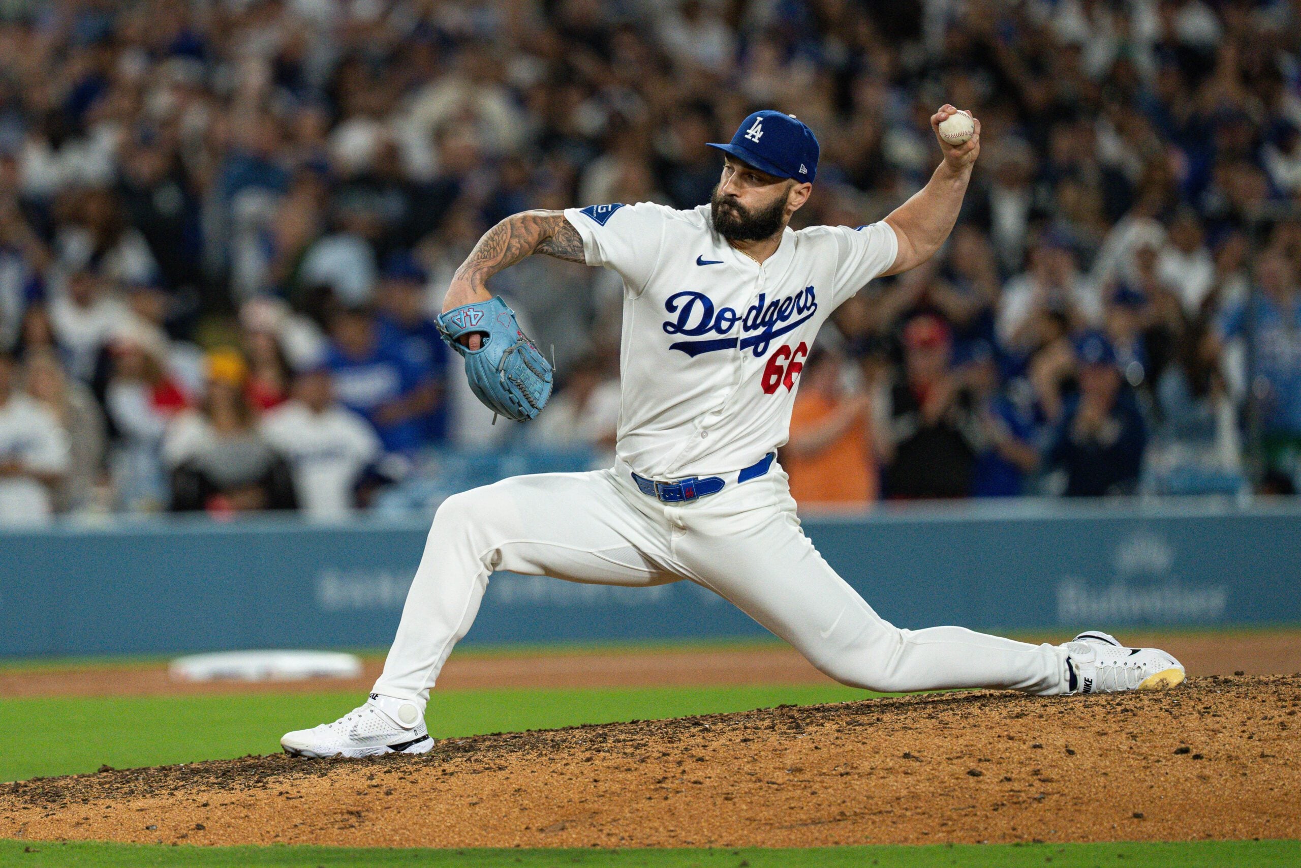 Jul 3, 2026; Los Angeles, California, USA; Los Angeles Dodgers pitcher Tanner Scott (66) earns a save in the top of the ninth inning against the San Diego Padres at Dodger Stadium. Mandatory Credit: Jon Endow-Imagn Images