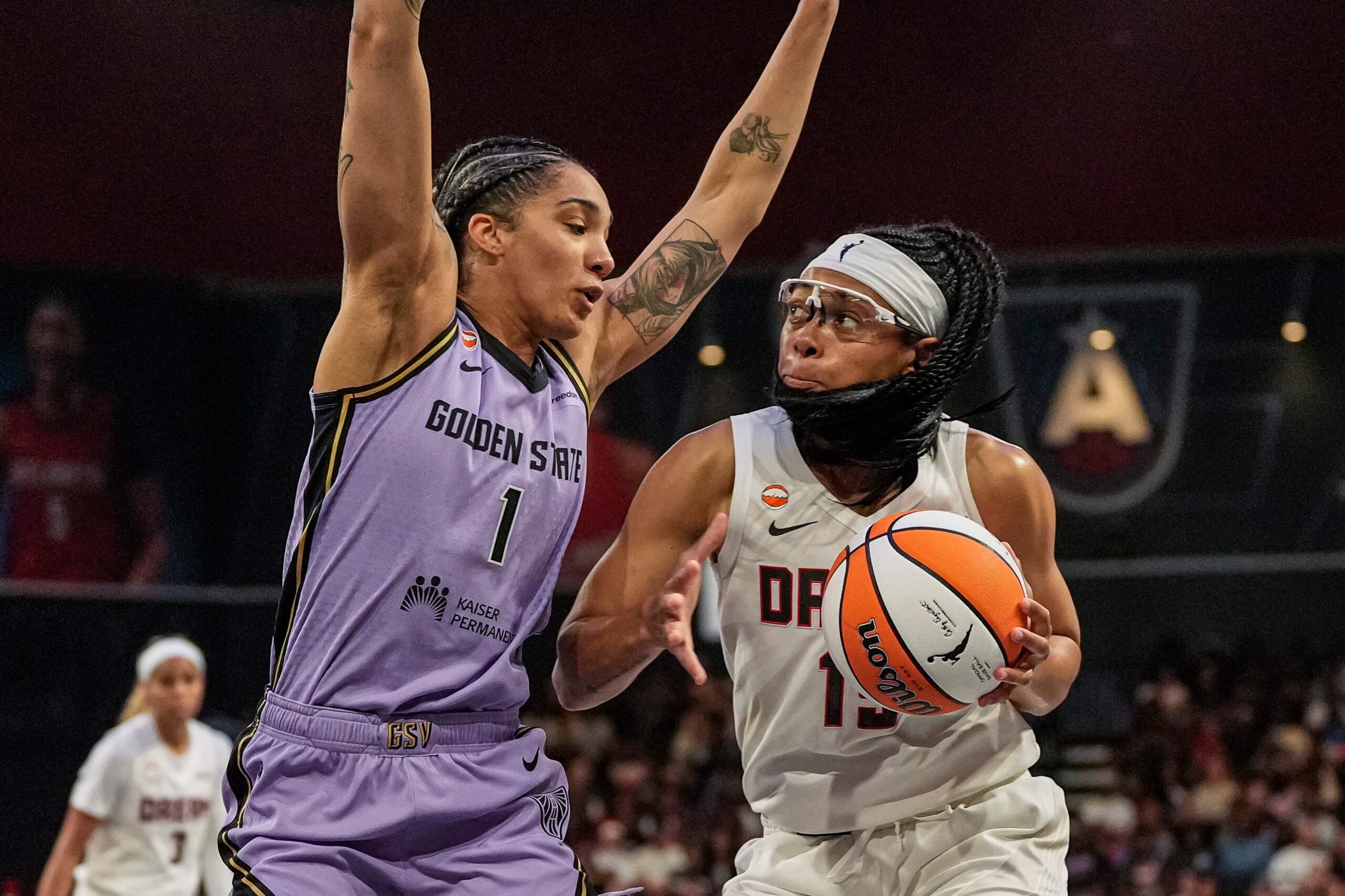 Jul 4, 2026; College Park, Georgia, USA; Atlanta Dream guard Allisha Gray (15) controls the ball against Golden State Valkyries forward Gabby Williams (1) during the first half at Gateway Center Arena at College Park. Mandatory Credit: Dale Zanine-Imagn Images