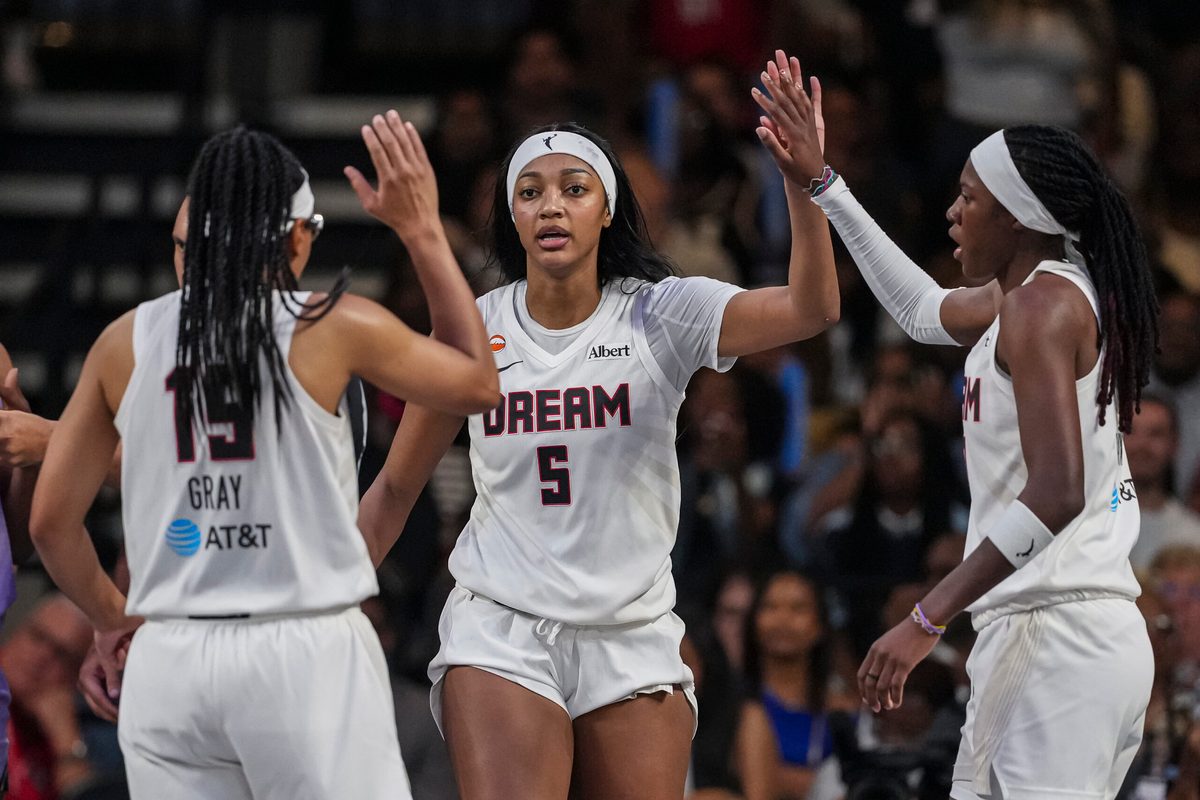 Jul 4, 2026; College Park, Georgia, USA; Atlanta Dream forward Angel Reese (5) react with guard Allisha Gray (15) and guard Rhyne Howard (10) against the Golden State Valkyries during the second half at Gateway Center Arena at College Park. Mandatory Credit: Dale Zanine-Imagn Images