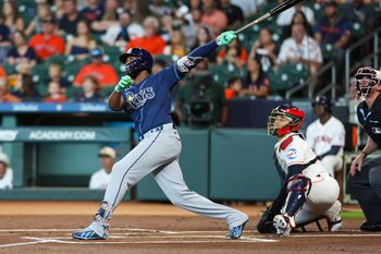 Jul 4, 2026; Houston, Texas, USA; Tampa Bay Rays third baseman Junior Caminero (13) hits a home run against the Houston Astros in the first inning at Daikin Park. Mandatory Credit: Thomas Shea-Imagn Images