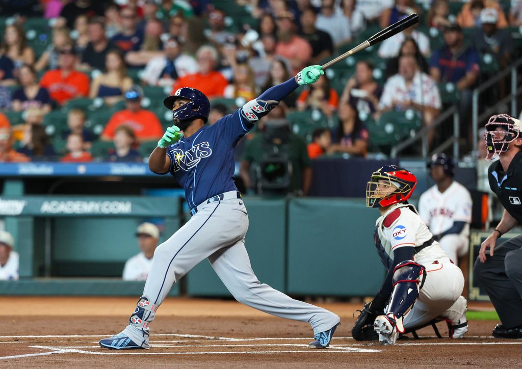 Jul 4, 2026; Houston, Texas, USA; Tampa Bay Rays third baseman Junior Caminero (13) hits a home run against the Houston Astros in the first inning at Daikin Park. Mandatory Credit: Thomas Shea-Imagn Images