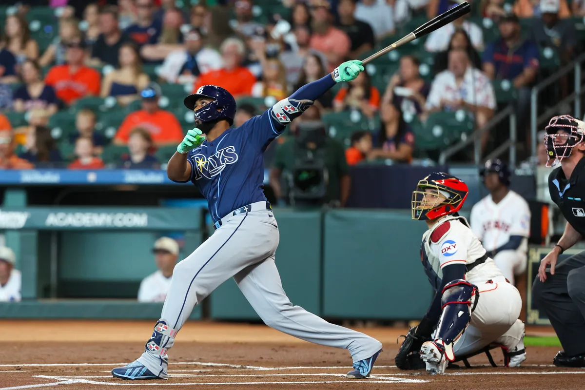 Jul 4, 2026; Houston, Texas, USA; Tampa Bay Rays third baseman Junior Caminero (13) hits a home run against the Houston Astros in the first inning at Daikin Park. Mandatory Credit: Thomas Shea-Imagn Images