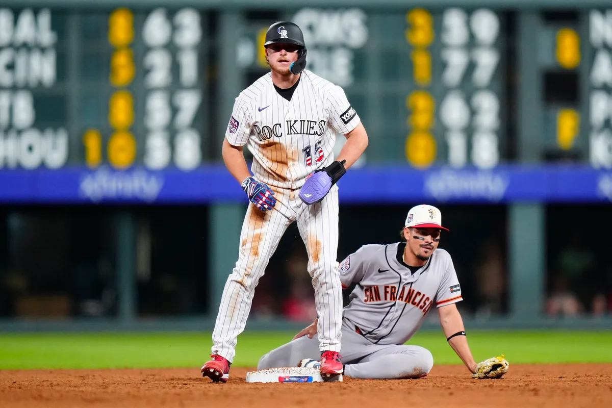 Jul 4, 2026; Denver, Colorado, USA; Colorado Rockies catcher Hunter Goodman (15) after advancing to second in the sixth inning against the San Francisco Giants at Coors Field. Mandatory Credit: Ron Chenoy-Imagn Images