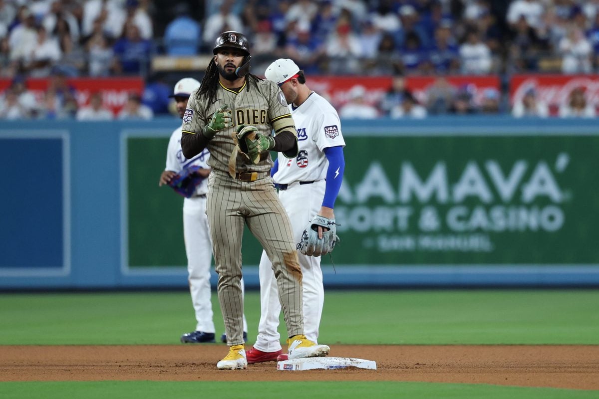 Jul 4, 2026; Los Angeles, California, USA; San Diego Padres right fielder Fernando Tatís Jr. (23) reacts at second base in the eighth inning against the Los Angeles Dodgers at Dodger Stadium. Mandatory Credit: Kiyoshi Mio-Imagn Images