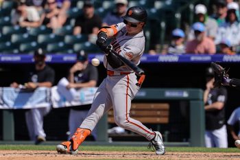 Jul 5, 2026; Denver, Colorado, USA; San Francisco Giants center fielder Drew Gilbert (0) hits an RBI single in the sixth inning against the Colorado Rockies at Coors Field. Mandatory Credit: Isaiah J. Downing-Imagn Images