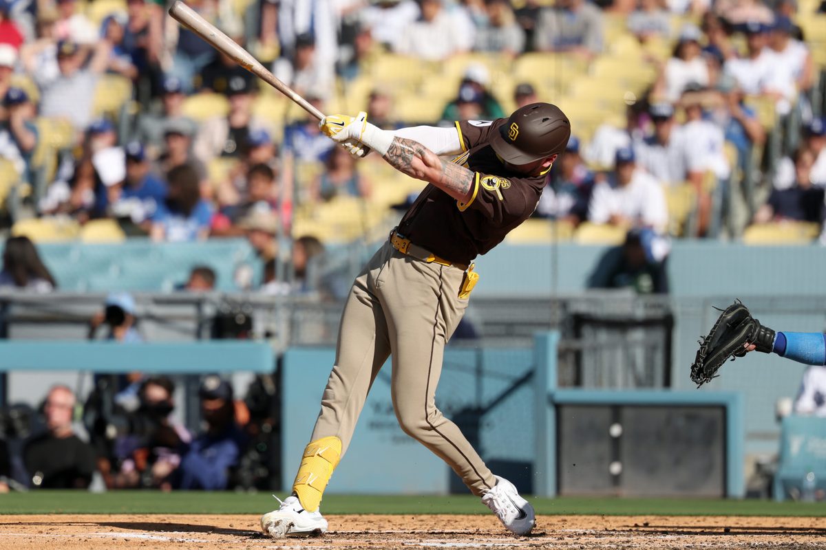 Jul 5, 2026; Los Angeles, California, USA; San Diego Padres center fielder Jackson Merrill (3) hits a RBI single in the fourth inning against the Los Angeles Dodgers at Dodger Stadium. Mandatory Credit: Kiyoshi Mio-Imagn Images