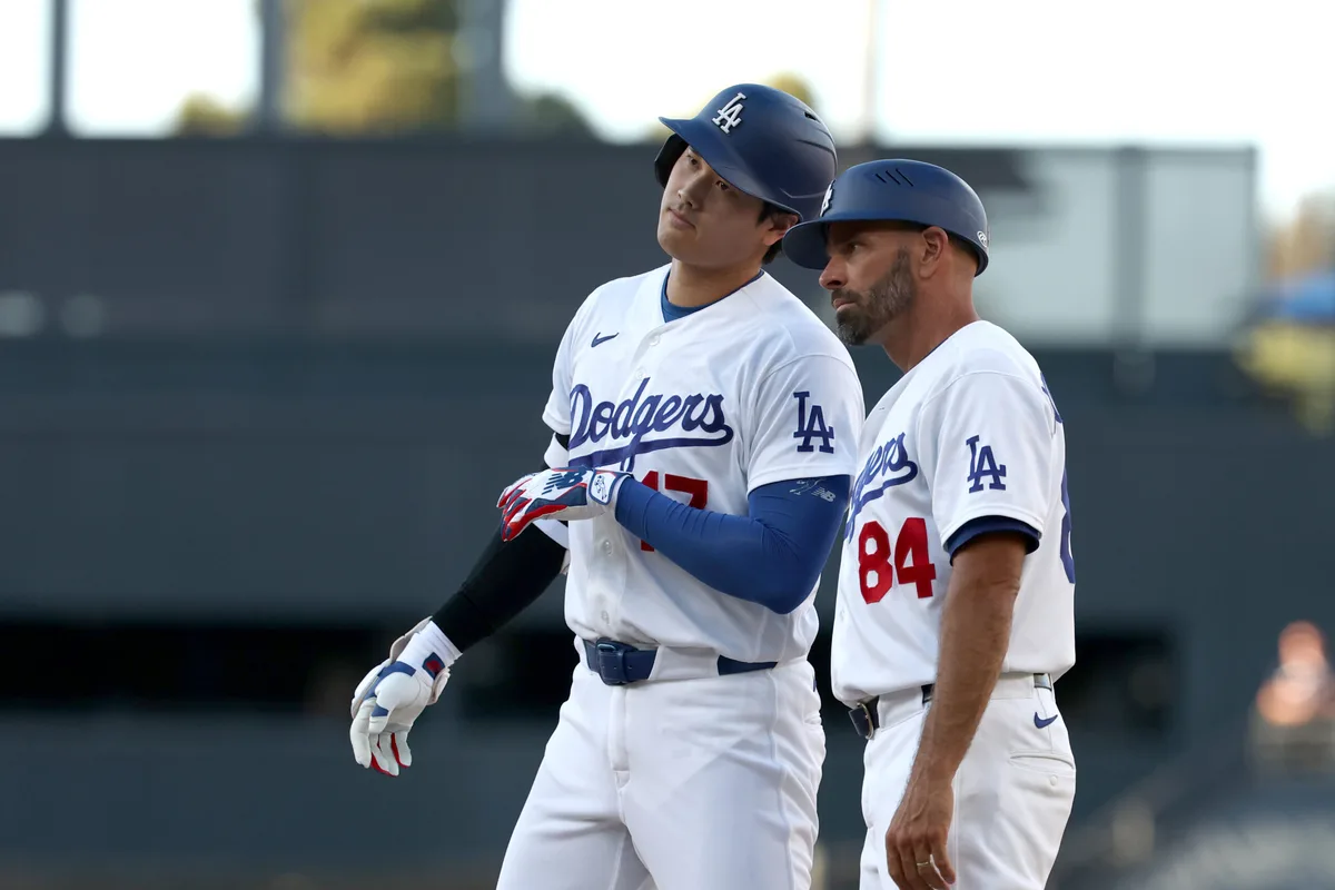 Jul 5, 2026; Los Angeles, California, USA; Los Angeles Dodgers designated hitter Shohei Ohtani (17) reacts at first base after hitting a 2-RBI single in the seventh inning against the San Diego Padres at Dodger Stadium. Mandatory Credit: Kiyoshi Mio-Imagn Images
