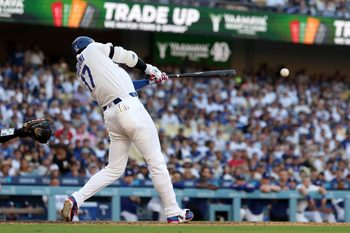 Jul 5, 2026; Los Angeles, California, USA; Los Angeles Dodgers designated hitter Shohei Ohtani (17) hits a 2-RBI single in the seventh inning against the San Diego Padres at Dodger Stadium. Mandatory Credit: Kiyoshi Mio-Imagn Images