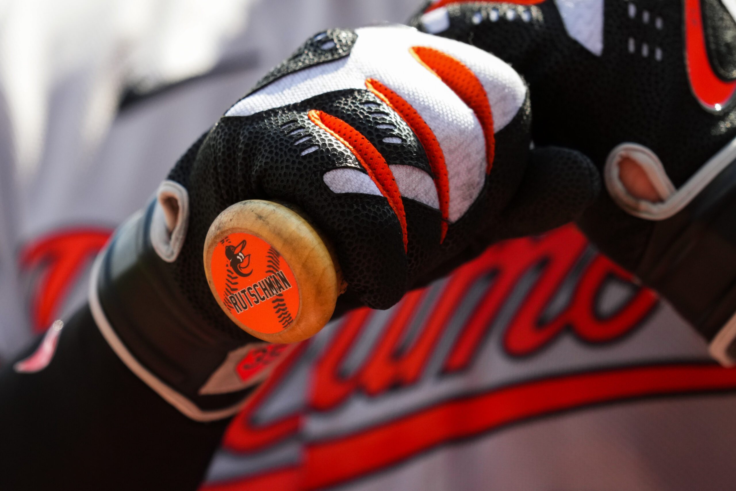 Jul 5, 2026; Cincinnati, Ohio, USA;  A view of the sticker on the bat knob of Baltimore Orioles catcher Adley Rutschman, as he waits on deck to bat against the Cincinnati Reds at Great American Ball Park. Mandatory Credit: Aaron Doster-Imagn Images