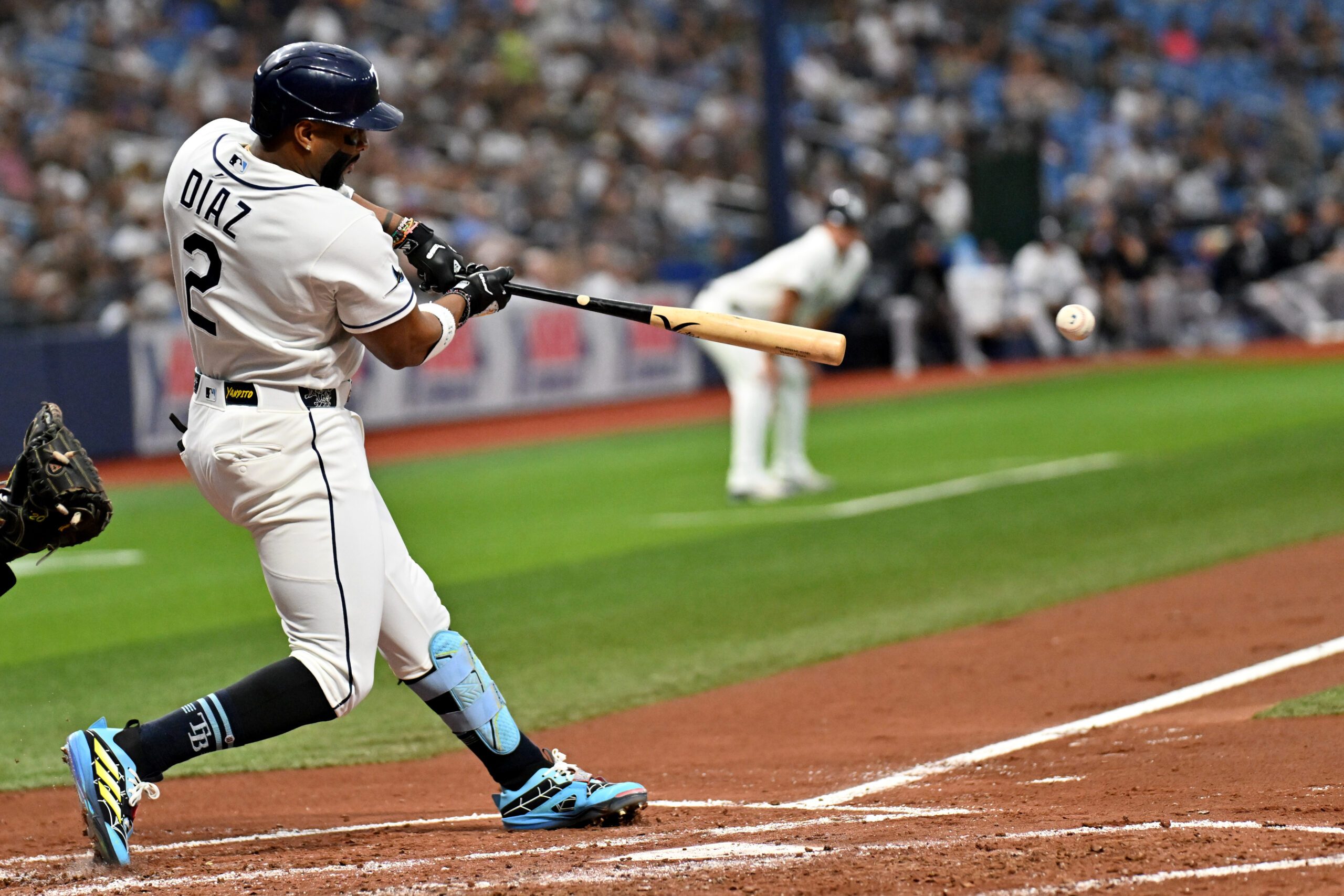 Jul 7, 2026; St. Petersburg, Florida, USA;  Tampa Bay Rays designated hitter Yandy Diaz (2) hits a RBI single in the second inning against the New York Yankees at Tropicana Field. Mandatory Credit: Jonathan Dyer-Imagn Images