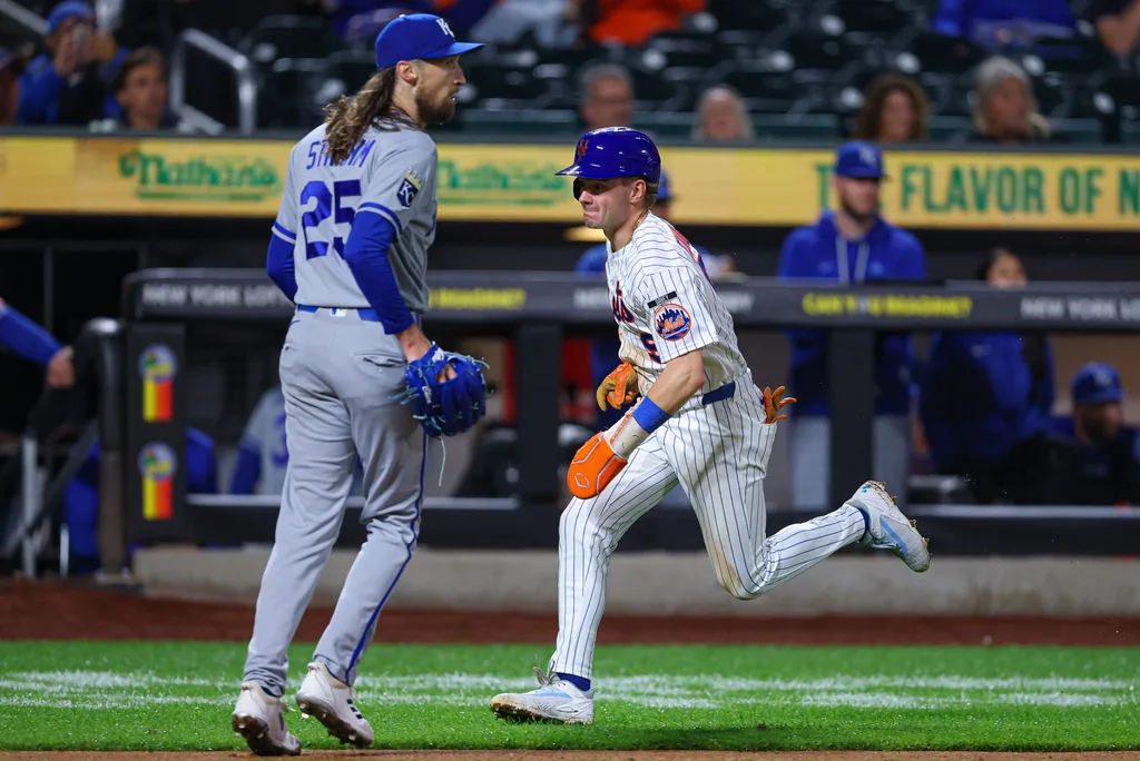 Jul 7, 2026; New York City, New York, USA; New York Mets center fielder A.J. Ewing (9) scores a run as Kansas City Royals pitcher Matt Strahm (25) looks up during the eighth inning at Citi Field. Mandatory Credit: Vincent Carchietta-Imagn Images
