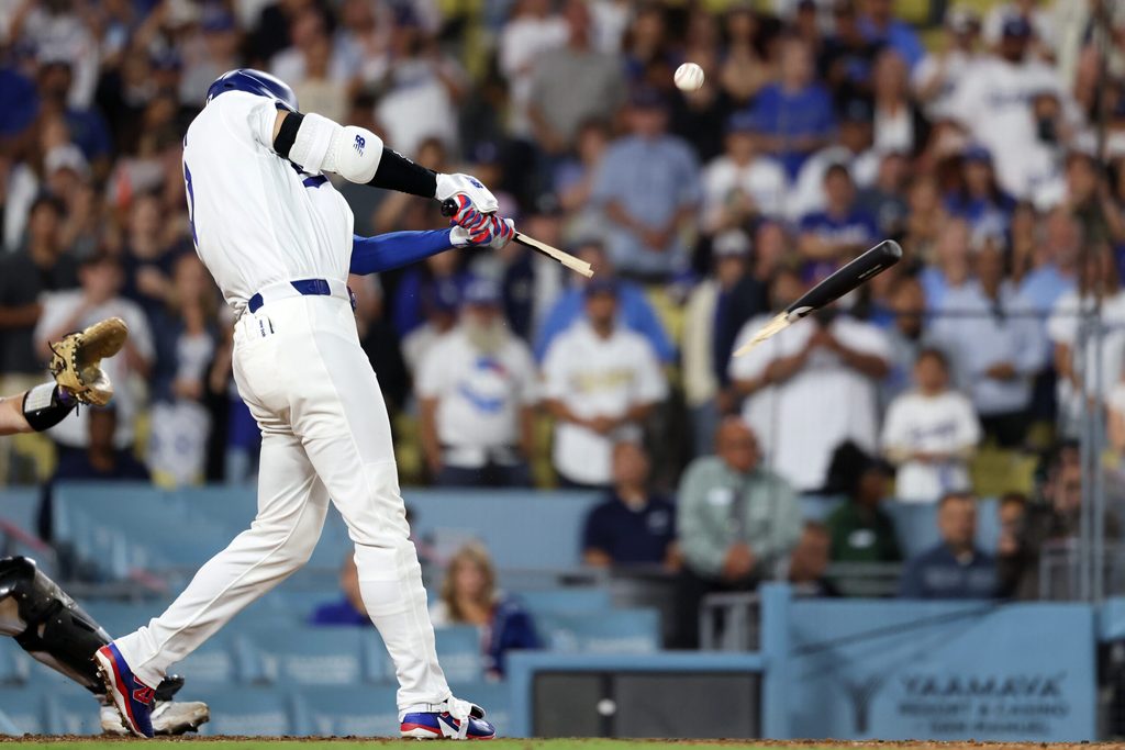 Jul 7, 2026; Los Angeles, California, USA; Los Angeles Dodgers designated hitter Shohei Ohtani (17) brakes his bat during the ninth inning against the Colorado Rockies at Dodger Stadium. Mandatory Credit: Kiyoshi Mio-Imagn Images