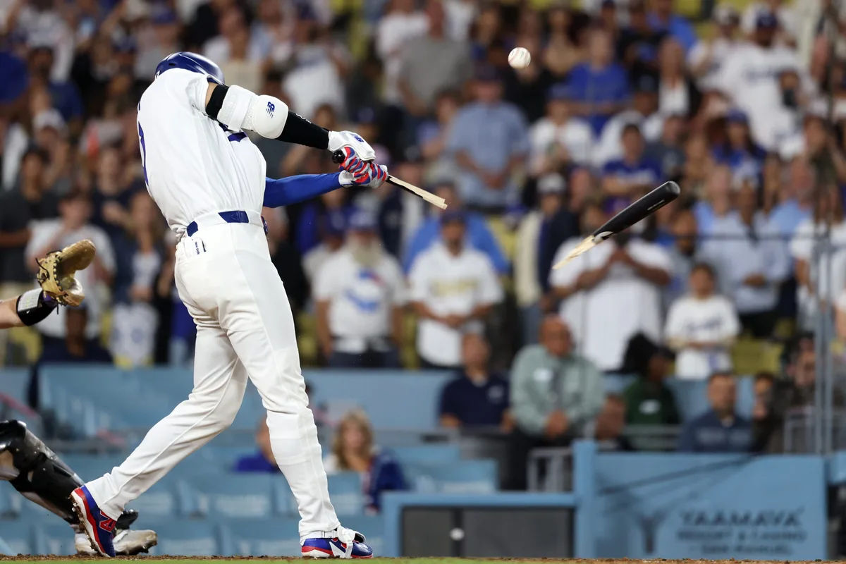 Jul 7, 2026; Los Angeles, California, USA; Los Angeles Dodgers designated hitter Shohei Ohtani (17) brakes his bat during the ninth inning against the Colorado Rockies at Dodger Stadium. Mandatory Credit: Kiyoshi Mio-Imagn Images