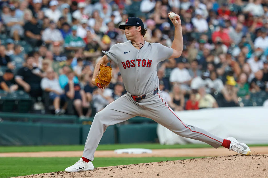 Jul 8, 2026; Chicago, Illinois, USA; Boston Red Sox starting pitcher Jake Bennett (64) delivers a pitch against the Chicago White Sox during the first inning at Rate Field. Mandatory Credit: Kamil Krzaczynski-Imagn Images