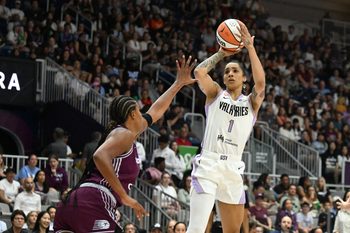 Jul 8, 2026; Toronto, Ontario, CAN;  Golden State Valkyries guard Gabby Williams (1) shoots the ball over Toronto Tempo forward Nyara Sabally (8) in the first half at Coca-Cola Coliseum. Mandatory Credit: Dan Hamilton-Imagn Images