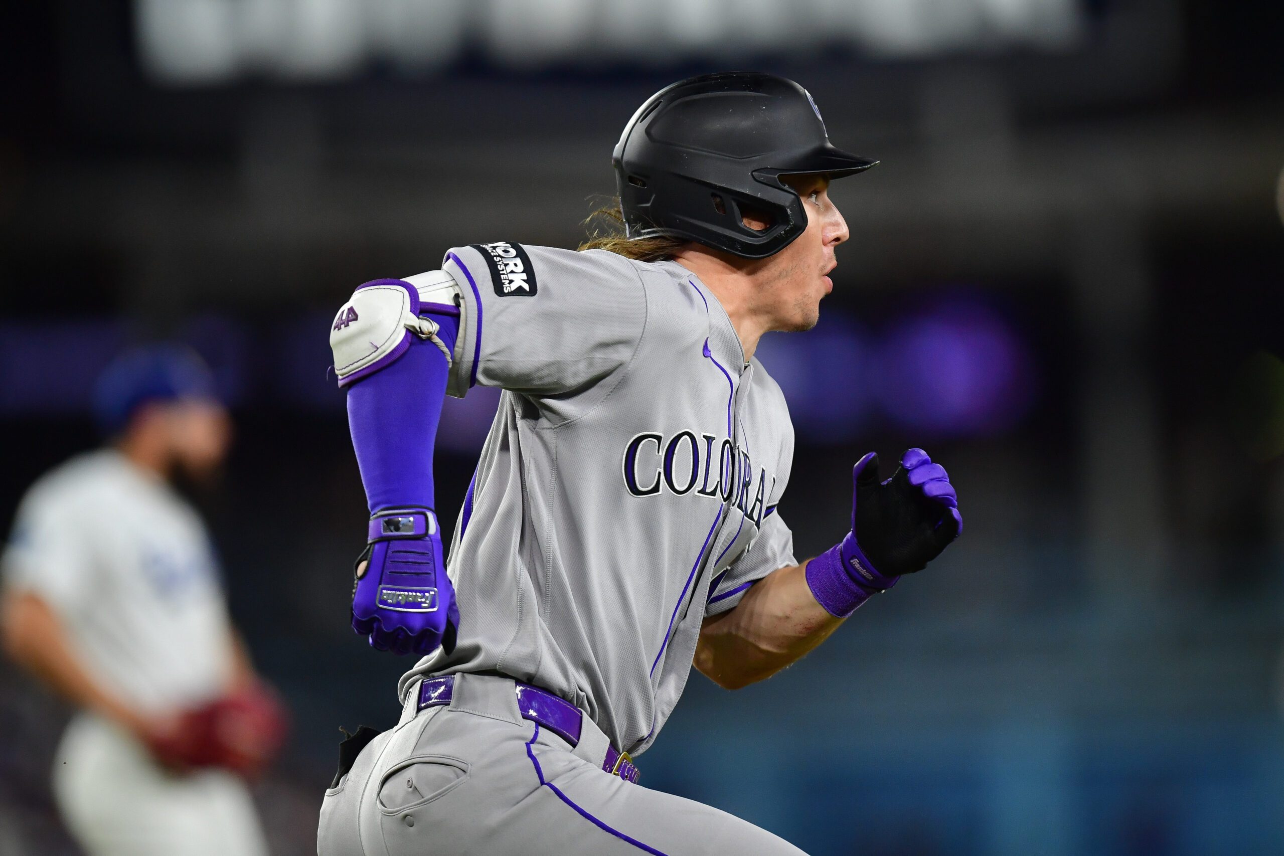Jul 8, 2026; Los Angeles, California, USA; Colorado Rockies center fielder Jake McCarthy (31) runs after hitting a double against the Los Angeles Dodgers during the eighth inning at Dodger Stadium. Mandatory Credit: Gary A. Vasquez-Imagn Images