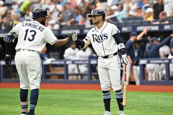Jul 9, 2026; St. Petersburg, Florida, USA; Tampa Bay Rays third baseman Junior Caminero (13) celebrates with center fielder Victor Mesa Jr. (25) after hitting a solo home run in the first inning against the New York Yankees at Tropicana Field. Mandatory Credit: Jonathan Dyer-Imagn Images