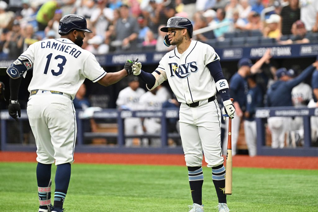 Jul 9, 2026; St. Petersburg, Florida, USA; Tampa Bay Rays third baseman Junior Caminero (13) celebrates with center fielder Victor Mesa Jr. (25) after hitting a solo home run in the first inning against the New York Yankees at Tropicana Field. Mandatory Credit: Jonathan Dyer-Imagn Images