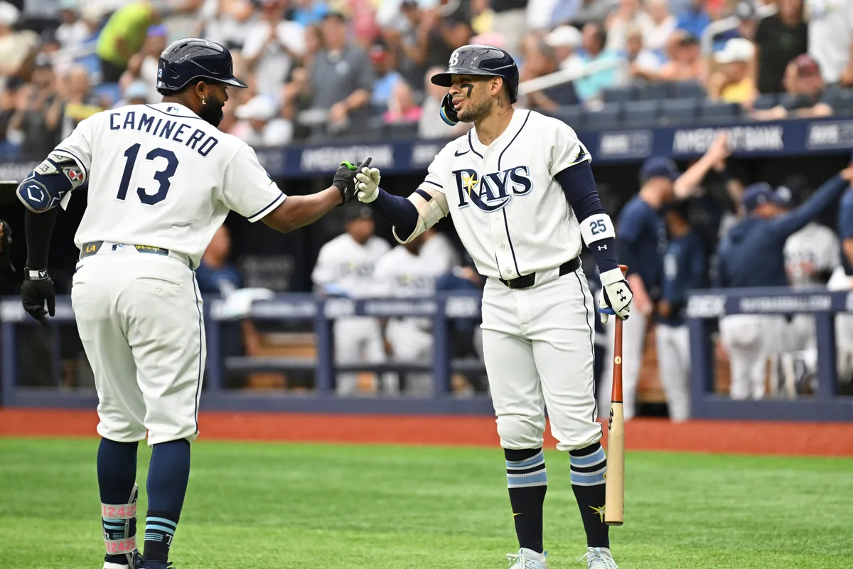 Jul 9, 2026; St. Petersburg, Florida, USA; Tampa Bay Rays third baseman Junior Caminero (13) celebrates with center fielder Victor Mesa Jr. (25) after hitting a solo home run in the first inning against the New York Yankees at Tropicana Field. Mandatory Credit: Jonathan Dyer-Imagn Images