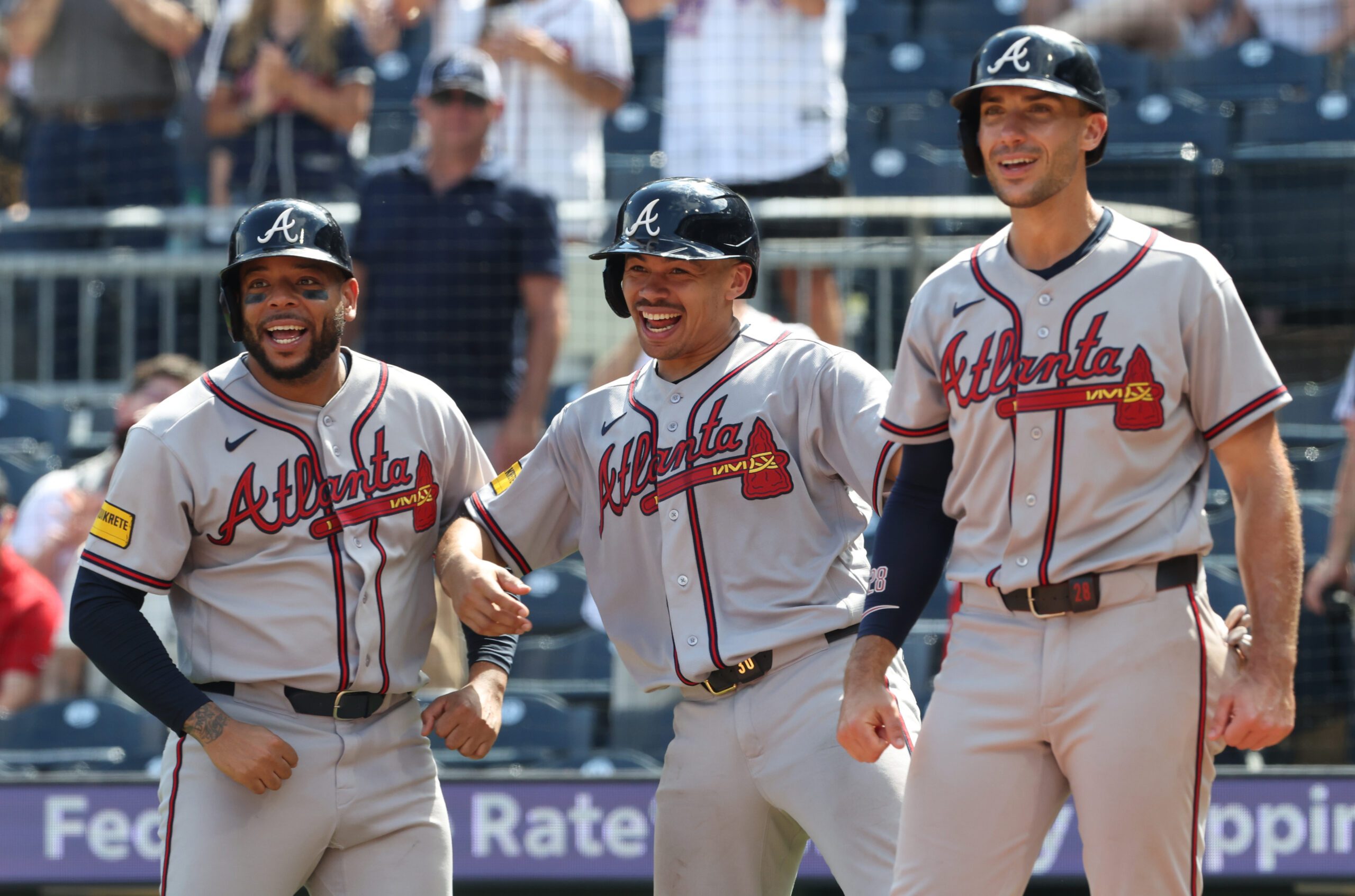 Jul 9, 2026; Pittsburgh, Pennsylvania, USA;  Atlanta Braves designated hitter Dominic Smith (left) and catcher Drake Baldwin (middle) and first baseman Matt Olson (right) react to a grand slam home run by right fielder Mike Yastrzemski (not pictured) against the Pittsburgh Pirates during the ninth inning at PNC Park. Mandatory Credit: Charles LeClaire-Imagn Images