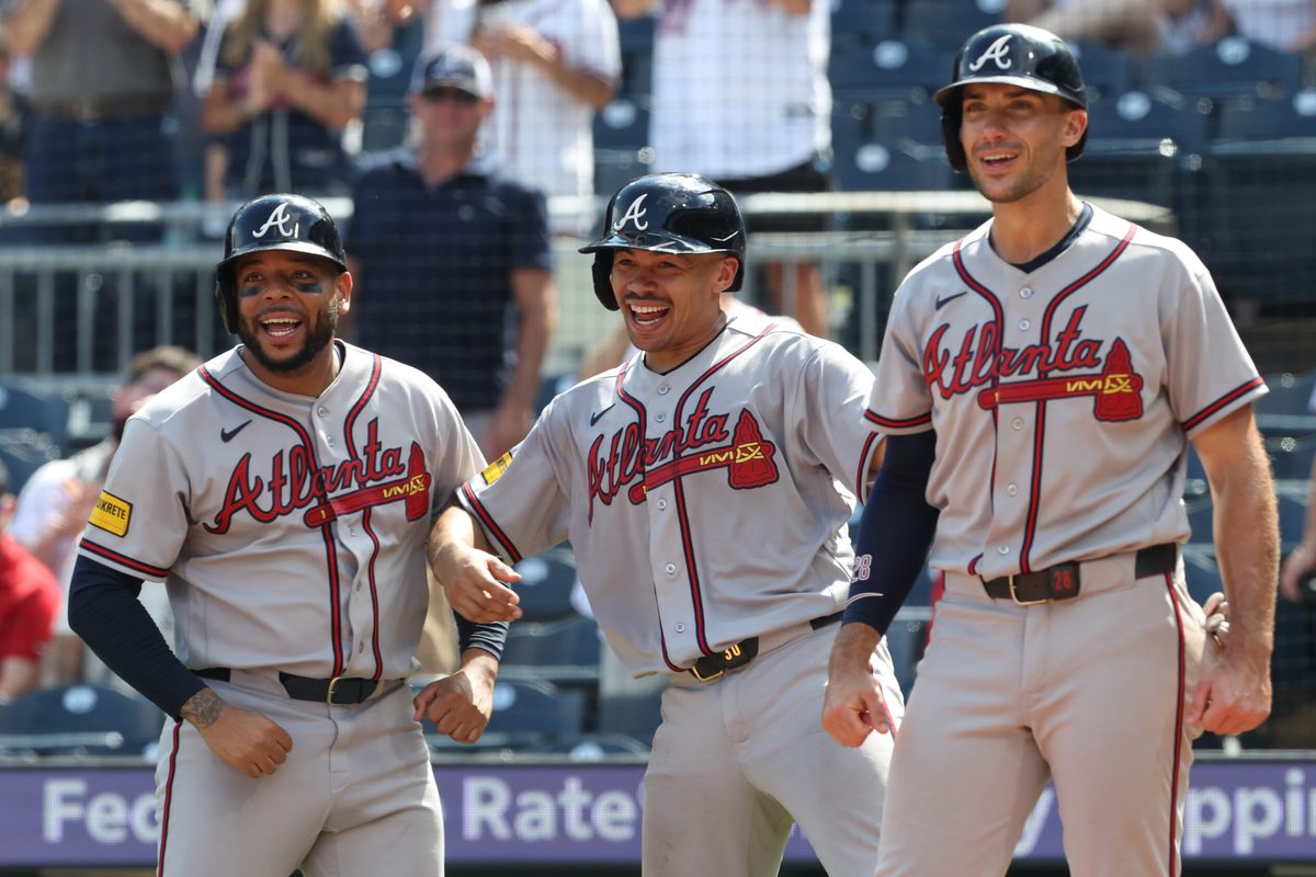 Jul 9, 2026; Pittsburgh, Pennsylvania, USA;  Atlanta Braves designated hitter Dominic Smith (left) and catcher Drake Baldwin (middle) and first baseman Matt Olson (right) react to a grand slam home run by right fielder Mike Yastrzemski (not pictured) against the Pittsburgh Pirates during the ninth inning at PNC Park. Mandatory Credit: Charles LeClaire-Imagn Images