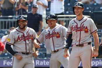 Jul 9, 2026; Pittsburgh, Pennsylvania, USA;  Atlanta Braves designated hitter Dominic Smith (left) and catcher Drake Baldwin (middle) and first baseman Matt Olson (right) react to a grand slam home run by right fielder Mike Yastrzemski (not pictured) against the Pittsburgh Pirates during the ninth inning at PNC Park. Mandatory Credit: Charles LeClaire-Imagn Images