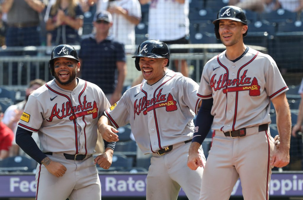 Jul 9, 2026; Pittsburgh, Pennsylvania, USA; Atlanta Braves designated hitter Dominic Smith (left) and catcher Drake Baldwin (middle) and first baseman Matt Olson (right) react to a grand slam home run by right fielder Mike Yastrzemski (not pictured) against the Pittsburgh Pirates during the ninth inning at PNC Park. Mandatory Credit: Charles LeClaire-Imagn Images