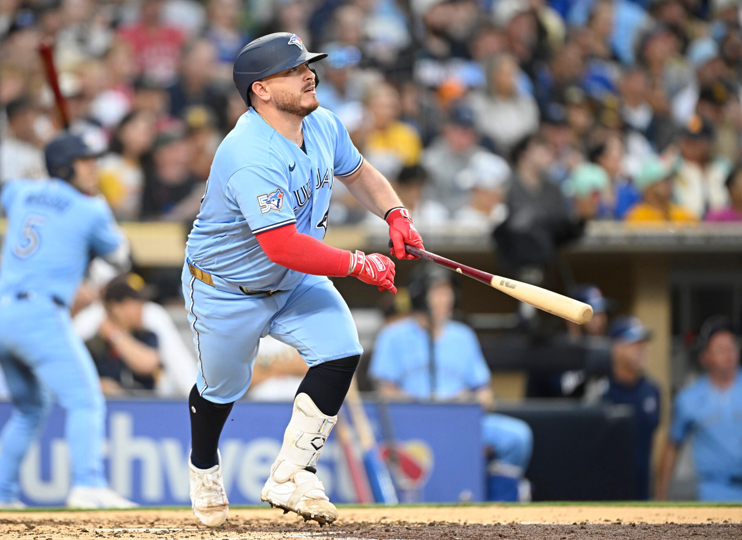 Jul 10, 2026; San Diego, California, USA; Toronto Blue Jays catcher Alejandro Kirk (30) hits an RBI double during the fourth inning against the San Diego Padres at Petco Park. Mandatory Credit: Denis Poroy-Imagn Images
