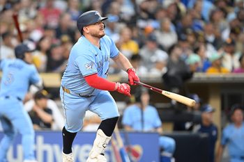 Jul 10, 2026; San Diego, California, USA; Toronto Blue Jays catcher Alejandro Kirk (30) hits an RBI double during the fourth inning against the San Diego Padres at Petco Park. Mandatory Credit: Denis Poroy-Imagn Images