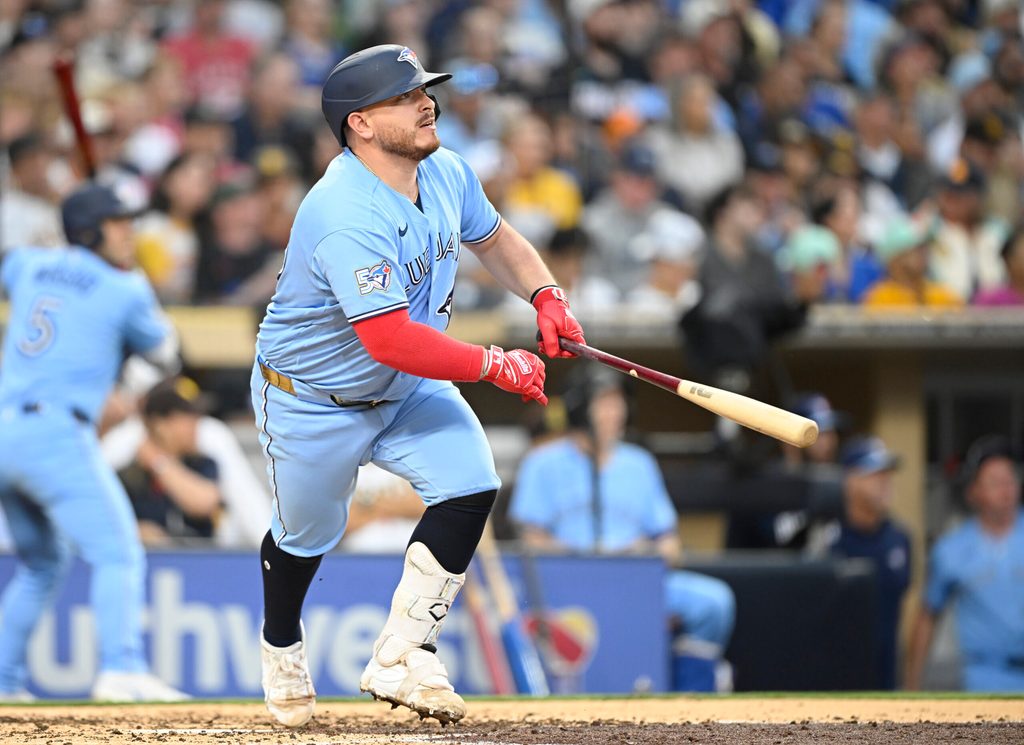 Jul 10, 2026; San Diego, California, USA; Toronto Blue Jays catcher Alejandro Kirk (30) hits an RBI double during the fourth inning against the San Diego Padres at Petco Park. Mandatory Credit: Denis Poroy-Imagn Images