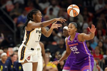 Jul 9, 2026; Phoenix, Arizona, USA; Indiana Fever center Aliyah Boston (7) passes the ball against Phoenix Mercury forward Alyssa Thomas (25) at Mortgage Matchup Center. Mandatory Credit: Mark J. Rebilas-Imagn Images