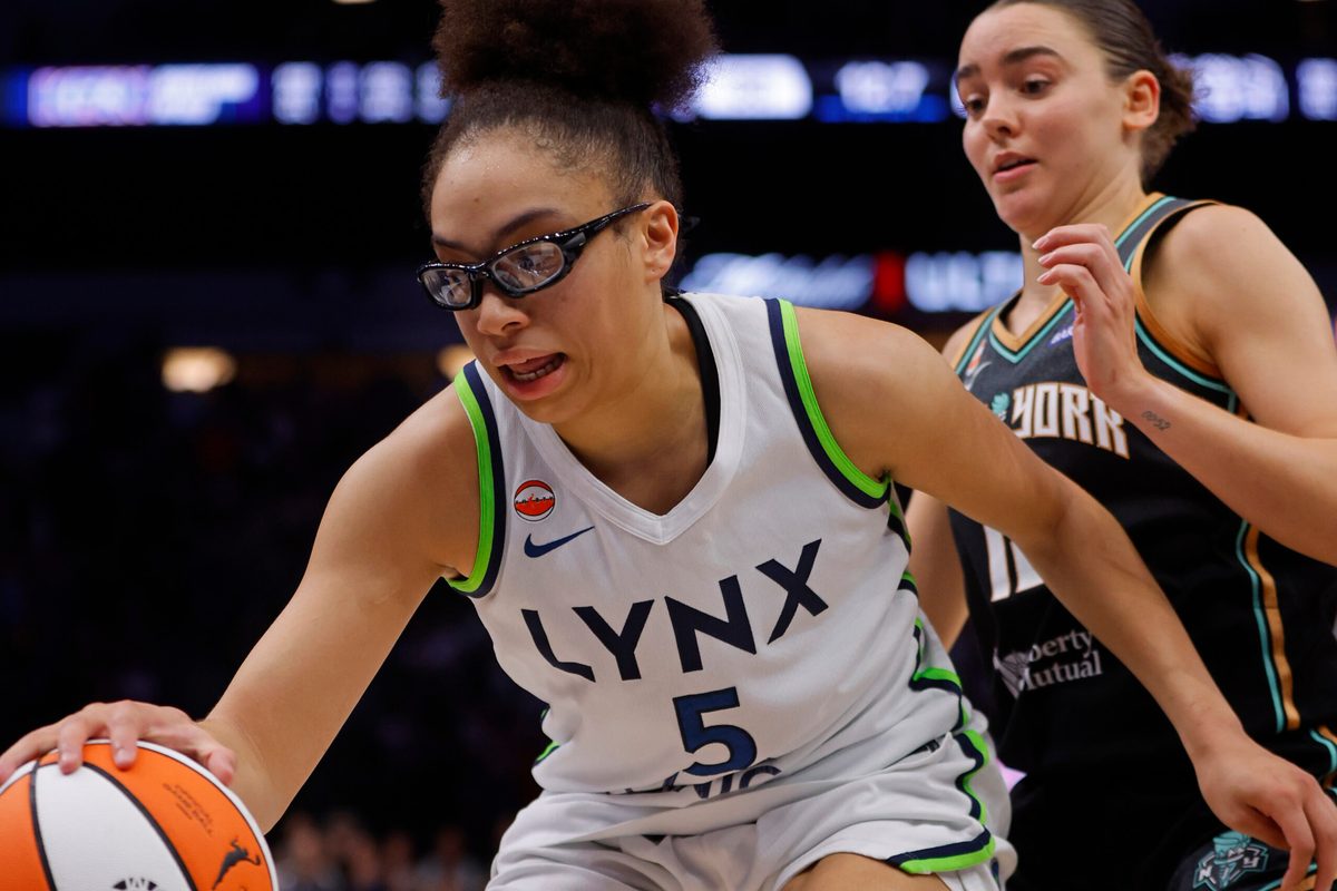 Jul 11, 2026; Minneapolis, Minnesota, USA; Minnesota Lynx guard Olivia Miles (5) grabs a rebound ahead of New York Liberty forward Pauline Astier (18) late in the fourth quarter at Target Center. Mandatory Credit: Bruce Kluckhohn-Imagn Images