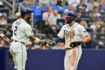 Jul 11, 2026; St. Petersburg, Florida, USA; Tampa Bay Rays second baseman Ben Williamson (15) celebrates a run with teammate designated hitter Yandy Diaz (2) during the eighth inning against Seattle Mariners at Tropicana Field. Mandatory Credit: Pablo Robles-Imagn Images