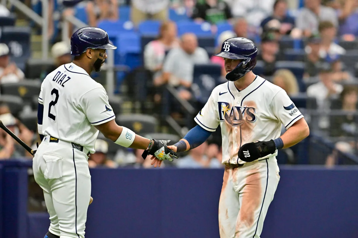 Jul 11, 2026; St. Petersburg, Florida, USA; Tampa Bay Rays second baseman Ben Williamson (15) celebrates a run with teammate designated hitter Yandy Diaz (2) during the eighth inning against Seattle Mariners at Tropicana Field. Mandatory Credit: Pablo Robles-Imagn Images
