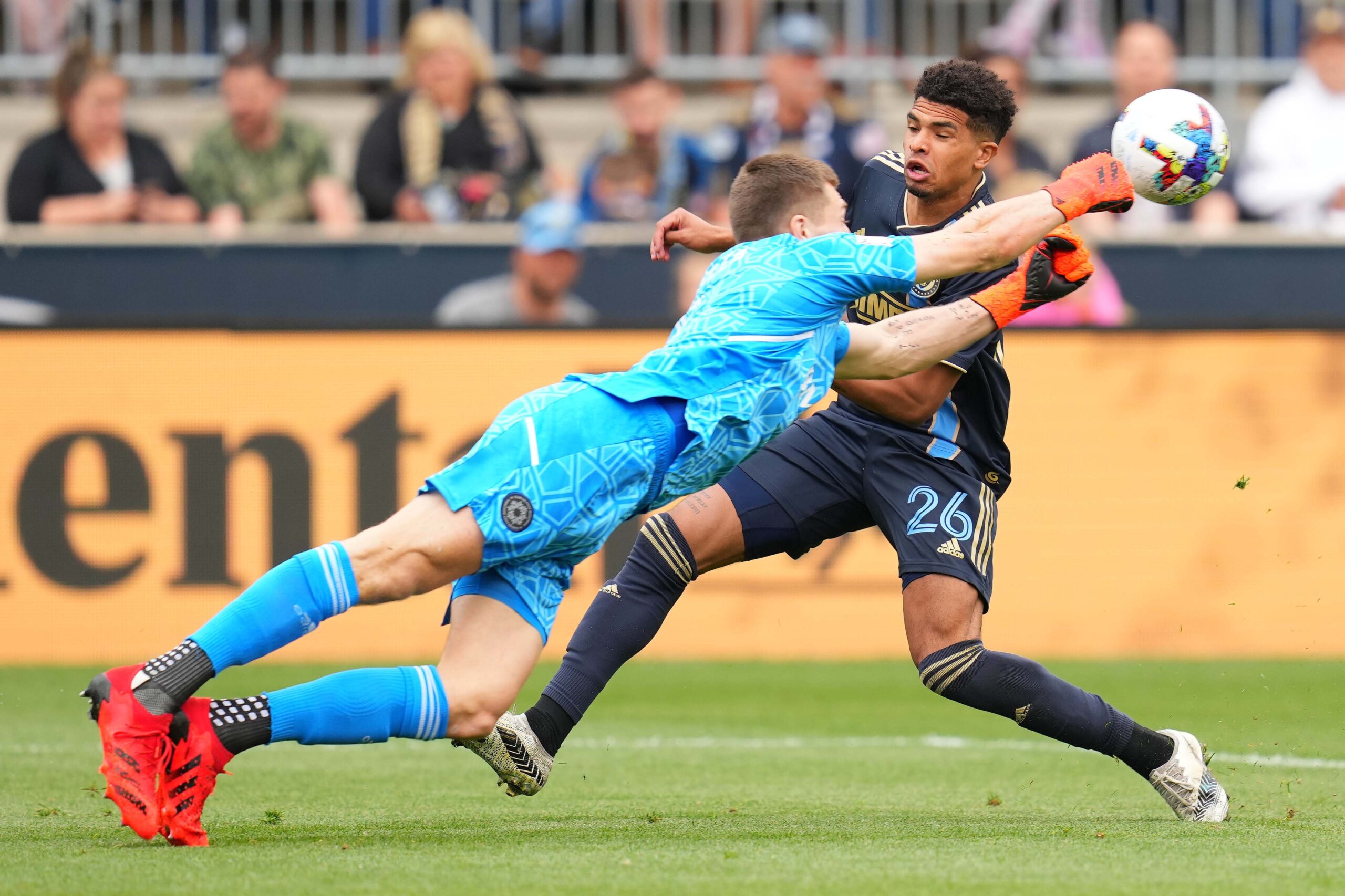 Apr 23, 2022; Chester, Pennsylvania, USA; CF Montr  al goalkeeper Sebastian Breza (1) makes a save against Philadelphia Union defender Nathan Harriel (26) during the first half at Subaru Park. Mandatory Credit: Mitchell Leff-Imagn Images